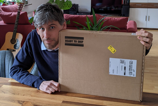 Giulio Mattioli holding a parcel in his hands